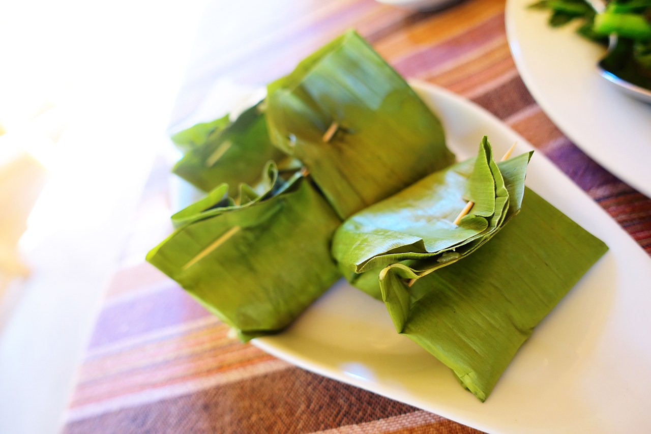 Steamed fish cakes wrapped in banana leaves