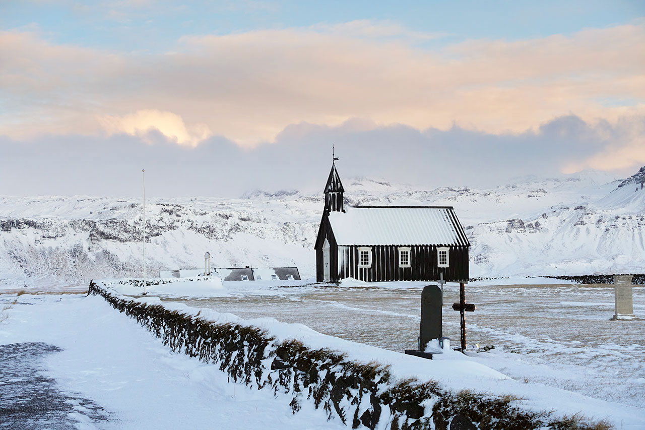 Búðir church sitting next to a graveyard in Búðahraun lava field.