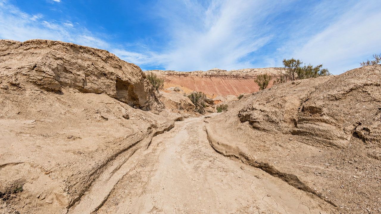 Walking along the dry, gravelly riverbed